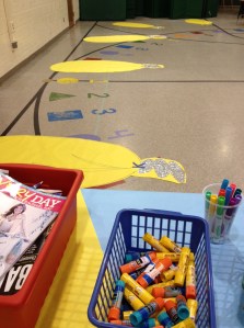 Students create a collage of writing ideas inside the light bulb. In this photo we're still waiting for the glue to dry to cut around the bottom!