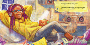 A girl wearing headphones, a hoodie, jeans and sneakers reclines on pillows in a bed, listening to a boombox which is on a desk in the background.