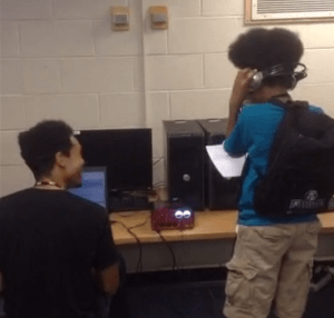 Jeffery Boston Weatherford sits at the mixer as a teenage MC records original rap lyrics.